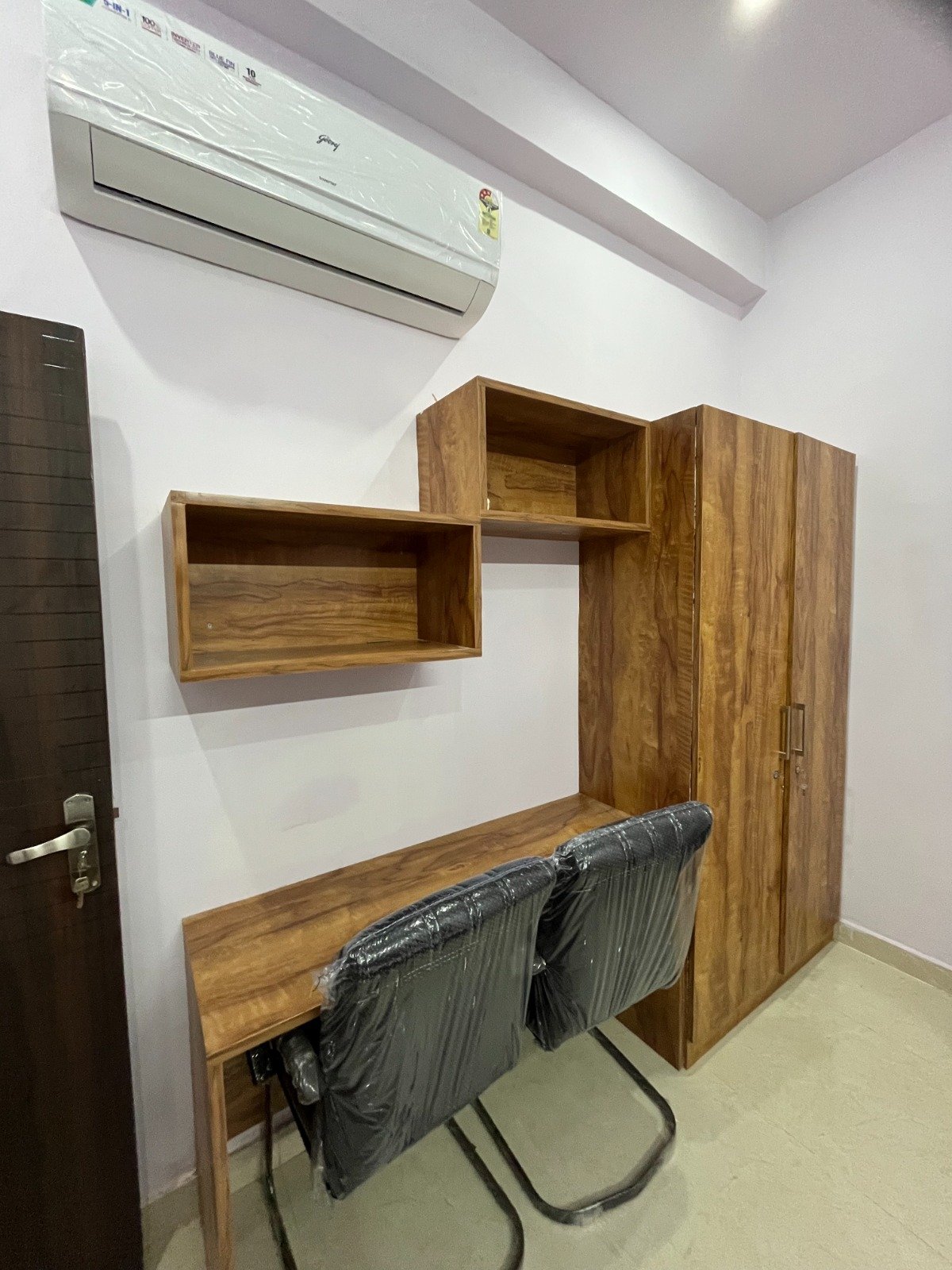 Room - table, chairs and shelves. The Cosmos - PG & Hostel For Girls.